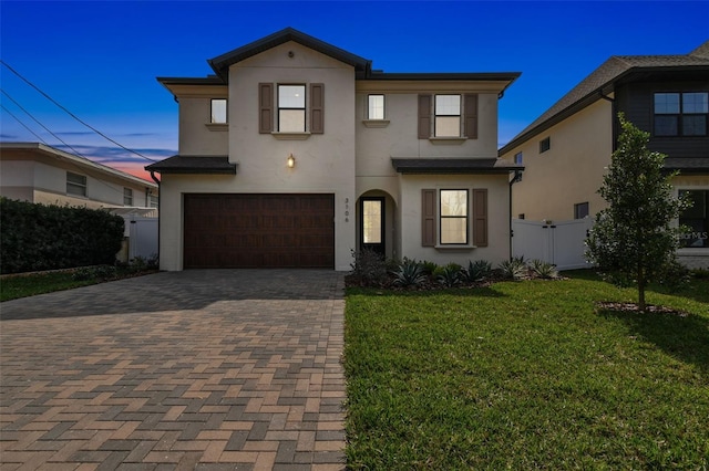 3113 W Nassau St, Tampa, FL 33607 - view of front of house with stucco siding, decorative driveway, and an attached garage
