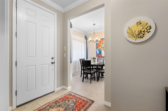 foyer with baseboards, a notable chandelier, ornamental molding, and light tile patterned floors