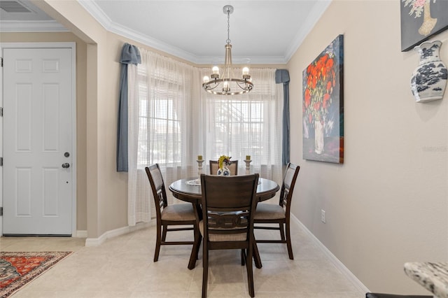 dining space featuring crown molding, baseboards, a notable chandelier, and visible vents