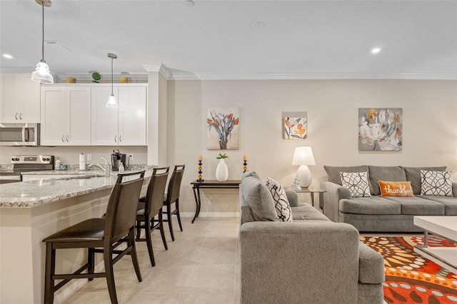 living room featuring recessed lighting, baseboards, ornamental molding, and light tile patterned floors