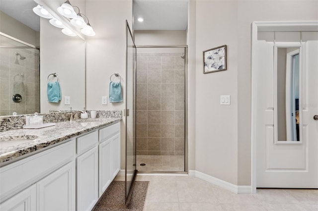 full bathroom with a sink, tile patterned floors, and a stall shower