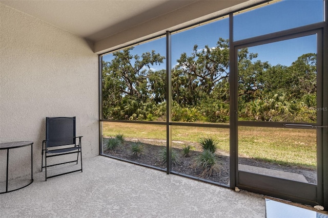 unfurnished sunroom featuring a healthy amount of sunlight