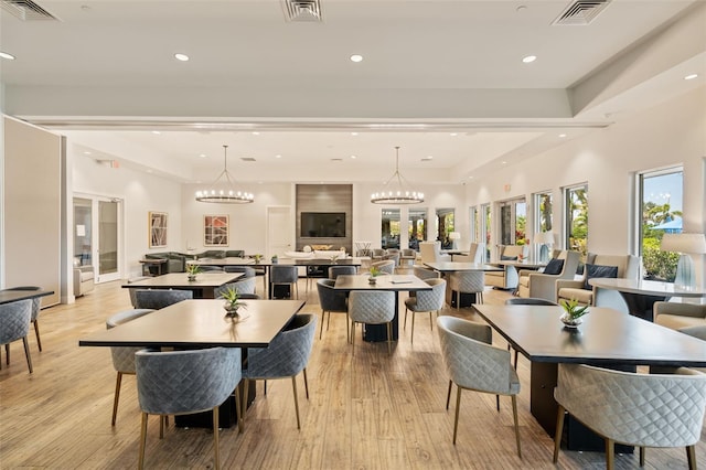 dining area with recessed lighting, visible vents, and light wood-type flooring