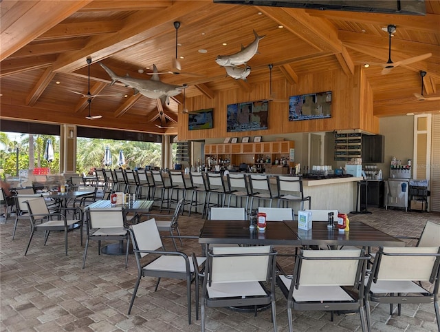 view of patio / terrace with a bar, a ceiling fan, and a gazebo