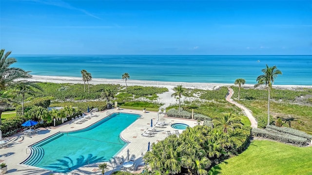 2185 Gulf Of Mexico Dr Unit 243, Longboat Key, FL 34228 - community pool with view of water and beach, a patio area, and a community hot tub
