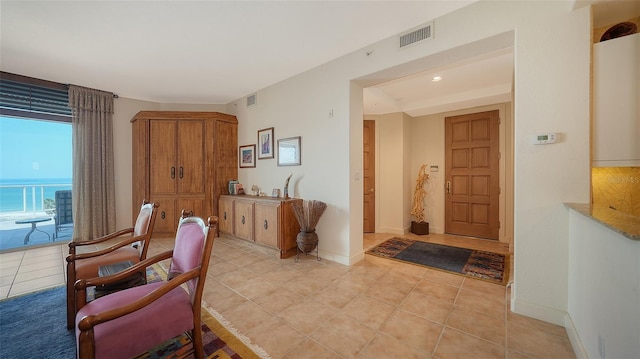 2185 Gulf Of Mexico Dr Unit 243, Longboat Key, FL 34228 - foyer entrance featuring light tile patterned floors, baseboards, and recessed lighting