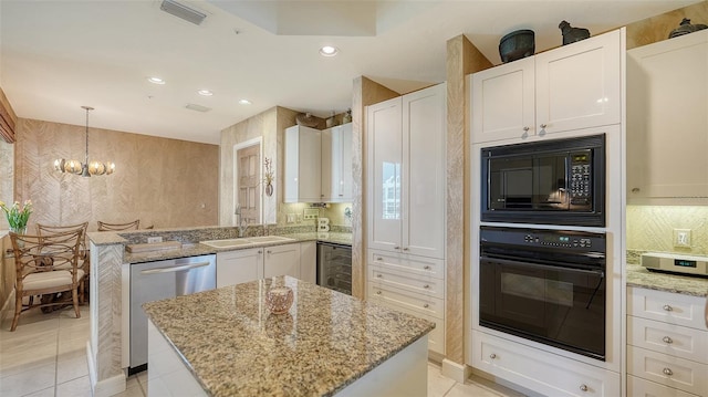 2185 Gulf Of Mexico Dr Unit 243, Longboat Key, FL 34228 - kitchen with oven, built in microwave, stainless steel dishwasher, white cabinetry, and beverage cooler