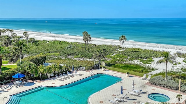 2185 Gulf Of Mexico Dr Unit 243, Longboat Key, FL 34228 - community pool featuring view of water and beach, a community hot tub, and a patio