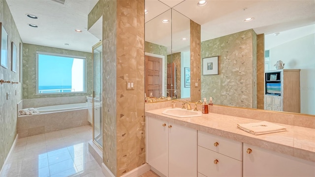 2185 Gulf Of Mexico Dr Unit 243, Longboat Key, FL 34228 - full bath with a garden tub, tile patterned flooring, double vanity, and recessed lighting
