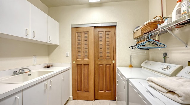 2185 Gulf Of Mexico Dr Unit 243, Longboat Key, FL 34228 - laundry area with cabinet space, separate washer and dryer, and light tile patterned floors