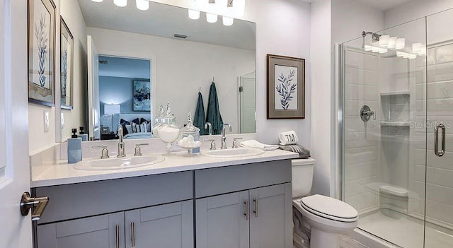 bathroom featuring connected bathroom, a sink, and a stall shower