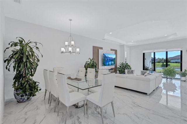 6203 Grandview Hill Ct, Bradenton, FL 34203 - dining space with a chandelier, light marble finish flooring, recessed lighting, and a tray ceiling
