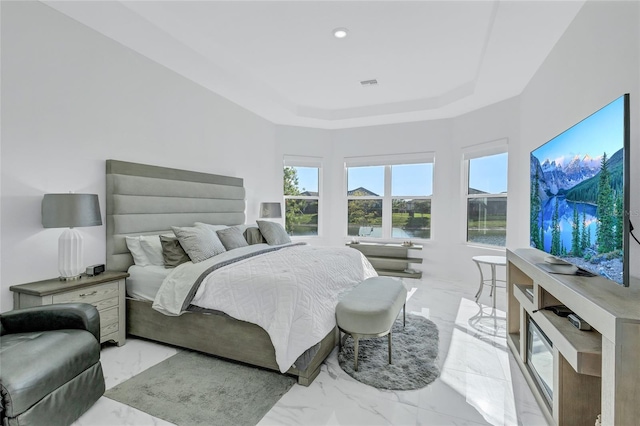 6203 Grandview Hill Ct, Bradenton, FL 34203 - bedroom with light marble finish flooring, a tray ceiling, and recessed lighting