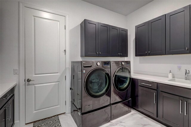 6203 Grandview Hill Ct, Bradenton, FL 34203 - laundry area featuring cabinet space, washing machine and clothes dryer, and light marble finish floors