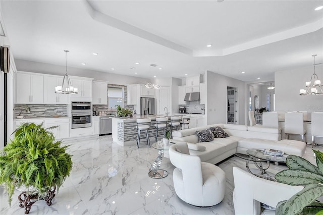 6203 Grandview Hill Ct, Bradenton, FL 34203 - living area with a chandelier, light marble finish floors, and recessed lighting