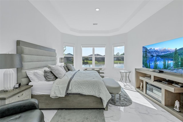 6203 Grandview Hill Ct, Bradenton, FL 34203 - bedroom with a raised ceiling and marble finish floors