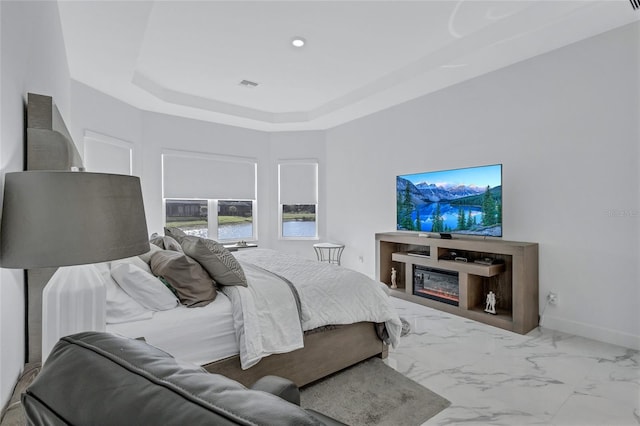 6203 Grandview Hill Ct, Bradenton, FL 34203 - bedroom featuring a raised ceiling and marble look tiles