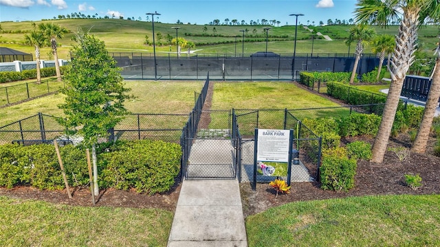 6203 Grandview Hill Ct, Bradenton, FL 34203 - view of tennis court with a gate