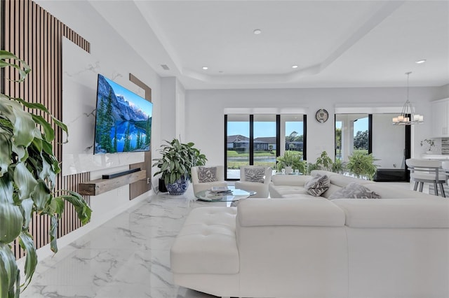 6203 Grandview Hill Ct, Bradenton, FL 34203 - living room featuring marble tiled floors, a chandelier, recessed lighting, and a tray ceiling