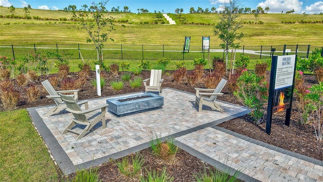 6203 Grandview Hill Ct, Bradenton, FL 34203 - view of patio with a fire pit and a rural view