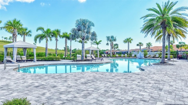 6203 Grandview Hill Ct, Bradenton, FL 34203 - community pool featuring a gazebo and a patio