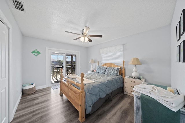 bedroom with visible vents, wood finished floors, ceiling fan, access to outside, and a textured ceiling