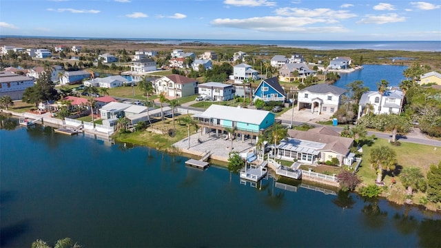 bird's eye view featuring a water view and a residential view