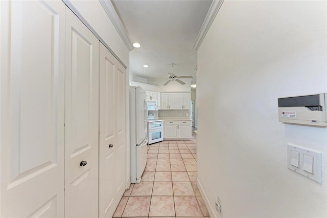 585 Khyber Ln, Venice, FL 34293 - hall with ornamental molding, light tile patterned floors, recessed lighting, and baseboards