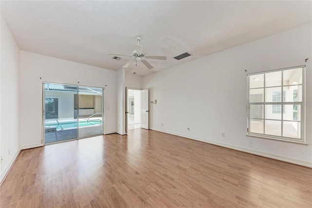 585 Khyber Ln, Venice, FL 34293 - empty room with a ceiling fan, light wood-style flooring, and baseboards