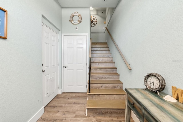 4717 Lemon Bay Dr, Venice, FL 34293 - stairs featuring baseboards, a textured wall, and wood finished floors