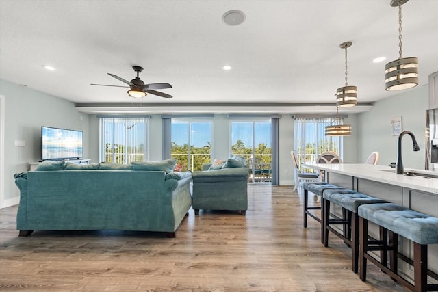 4717 Lemon Bay Dr, Venice, FL 34293 - living room featuring a healthy amount of sunlight and recessed lighting