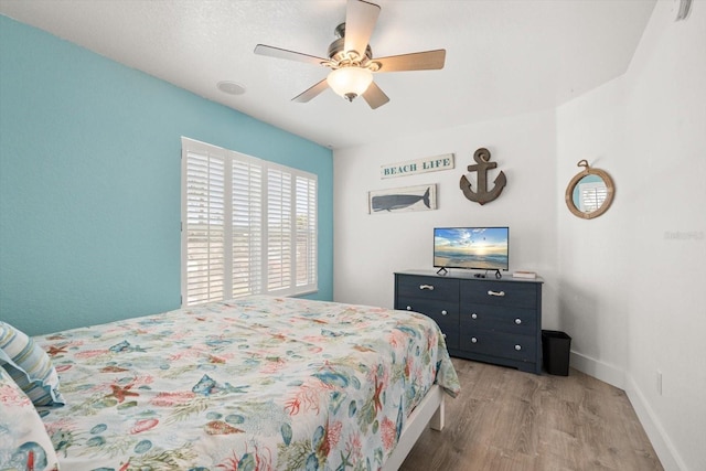 4717 Lemon Bay Dr, Venice, FL 34293 - bedroom featuring a ceiling fan, baseboards, and wood finished floors