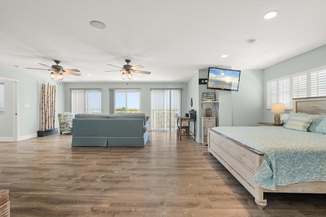 4717 Lemon Bay Dr, Venice, FL 34293 - bedroom with recessed lighting, wood finished floors, and multiple windows