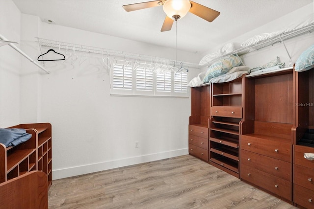 4717 Lemon Bay Dr, Venice, FL 34293 - spacious closet featuring a ceiling fan and wood finished floors