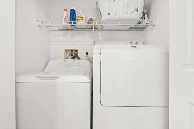 4717 Lemon Bay Dr, Venice, FL 34293 - clothes washing area featuring washing machine and clothes dryer and laundry area