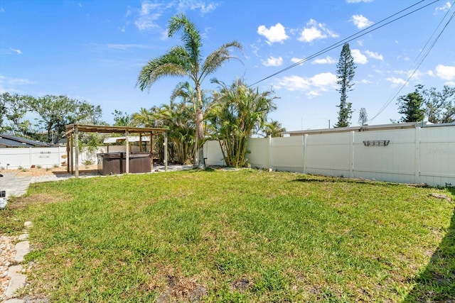 4717 Lemon Bay Dr, Venice, FL 34293 - view of yard featuring a fenced backyard and a hot tub