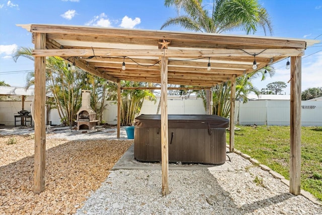 4717 Lemon Bay Dr, Venice, FL 34293 - view of patio / terrace featuring a fenced backyard and a hot tub