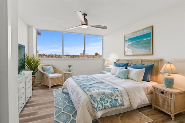 bedroom featuring a ceiling fan and light wood-style floors