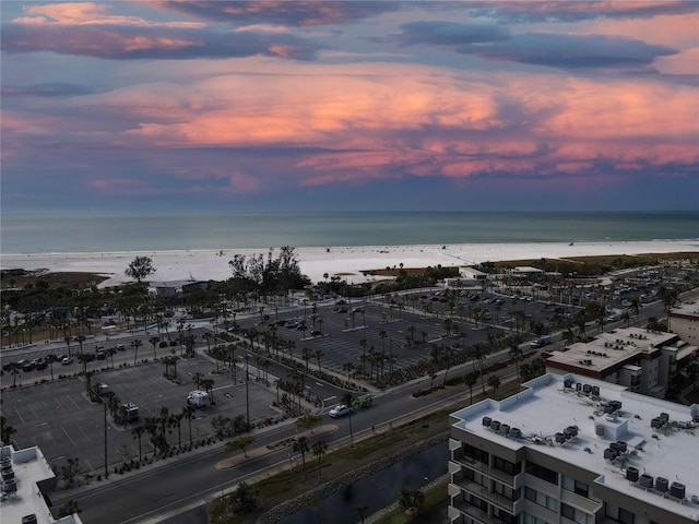 bird's eye view featuring a view of the beach and a water view