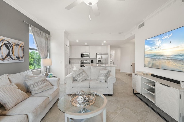 living area with ornamental molding, light tile patterned floors, ceiling fan, and recessed lighting