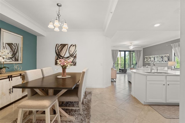 dining space with ornamental molding, a ceiling fan, a chandelier, light tile patterned floors, and baseboards