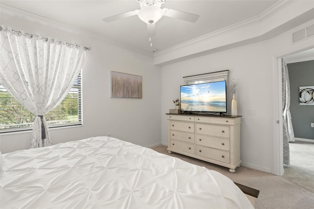 bedroom with light carpet, ornamental molding, ceiling fan, and baseboards
