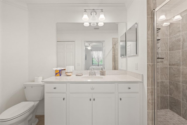 bathroom featuring a stall shower, ornamental molding, toilet, and vanity