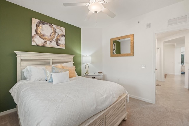 bedroom featuring carpet, baseboards, and a ceiling fan