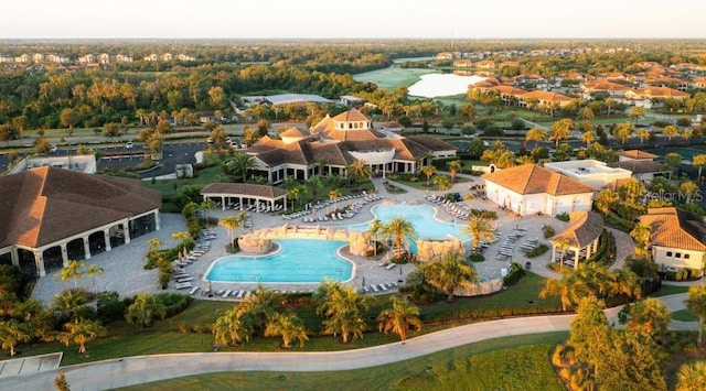 aerial perspective of suburban area featuring a pool area