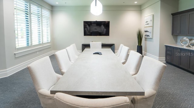 carpeted dining room featuring baseboards, healthy amount of natural light, and recessed lighting