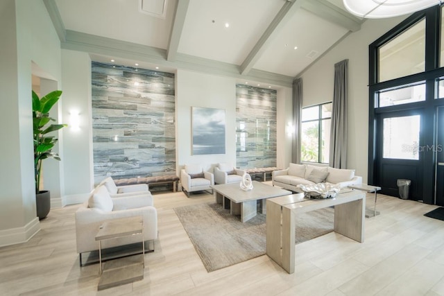 community lobby featuring beamed ceiling and high vaulted ceiling