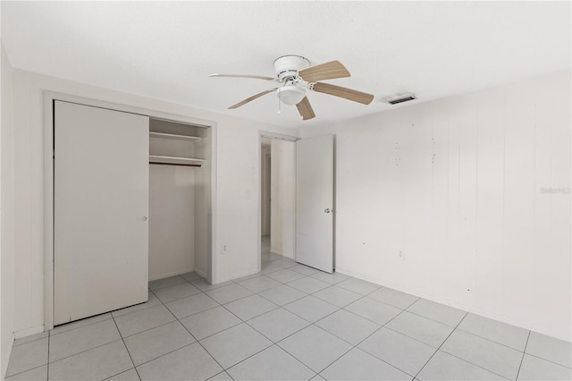 1802 Robinhood St, Sarasota, FL 34231 - unfurnished bedroom with visible vents, ceiling fan, light tile patterned flooring, and a closet
