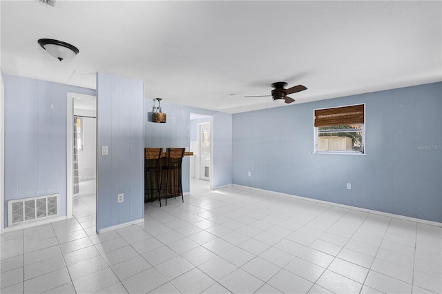 1802 Robinhood St, Sarasota, FL 34231 - unfurnished living room with visible vents, baseboards, ceiling fan, and tile patterned floors
