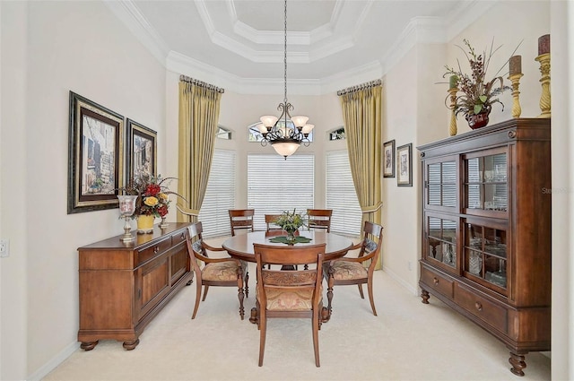 2111 Muskogee Trl, Nokomis, FL 34275 - dining area with light colored carpet, crown molding, baseboards, a chandelier, and a tray ceiling